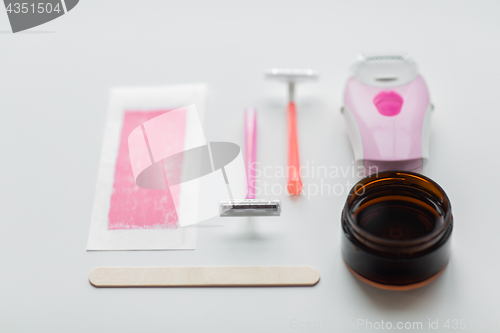 Image of safety razor, epilator, hair removal wax and patch