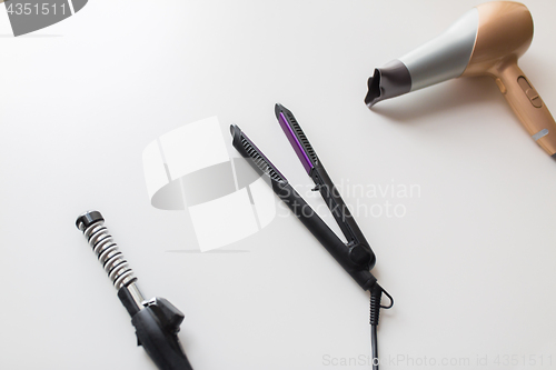 Image of hairdryer, hot styler and curling iron or tongs