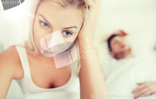 Image of awake woman having insomnia in bed