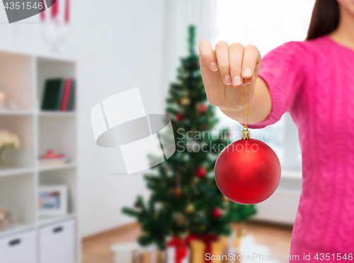 Image of close up of woman hand with christmas ball