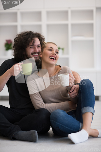 Image of young couple in their new home