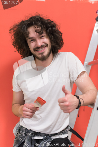 Image of man with funny hair over color background with brush