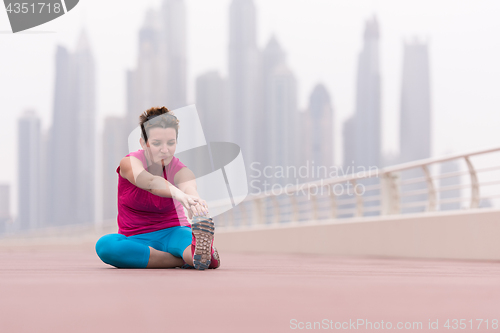 Image of woman stretching and warming up