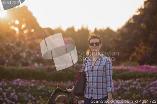 Image of mother and daughter in flower garden