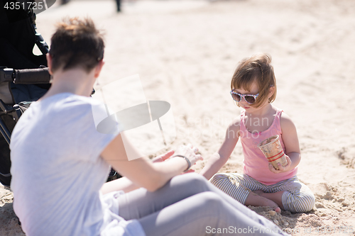 Image of Mom and daughter on the beach