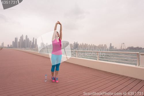 Image of woman stretching and warming up