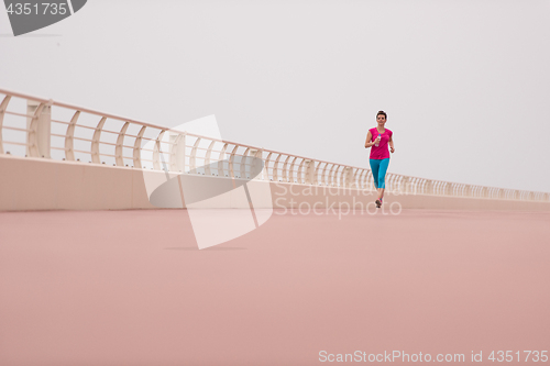 Image of woman busy running on the promenade