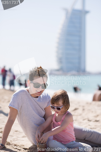 Image of Mom and daughter on the beach