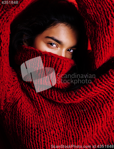 Image of young pretty indian mulatto girl in red sweater posing emotional, fashion hipster teenage, lifestyle people concept 
