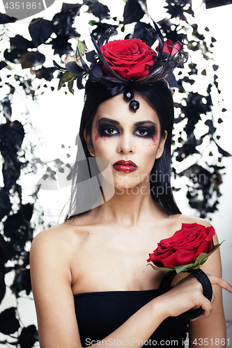 Image of pretty brunette woman with rose jewelry, black and red, bright m