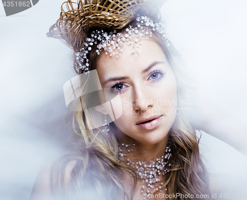 Image of beauty young snow queen with hair crown on her head, complicate 