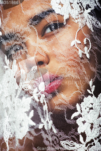 Image of portrait of beauty young afro woman through white lace, like new