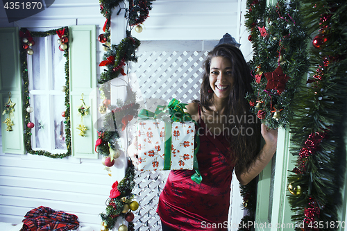 Image of pretty happy smiling young teenage hipster girl infront of decor