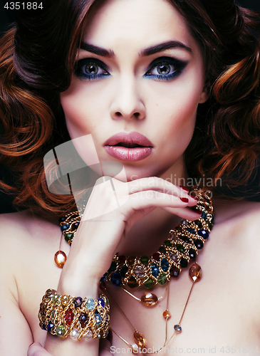 Image of beauty rich woman with luxury jewellery looks like mature