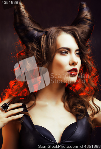 Image of bright mysterious woman with horn hair, halloween celebration