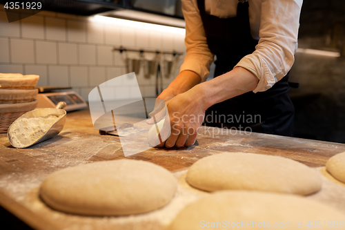 Image of chef or baker cooking dough at bakery
