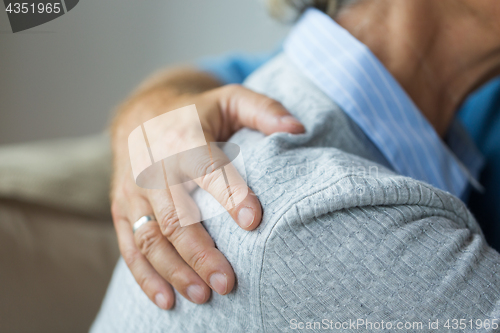 Image of close up of married senior couple hugging