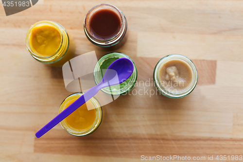 Image of vegetable or fruit puree or baby food in jars