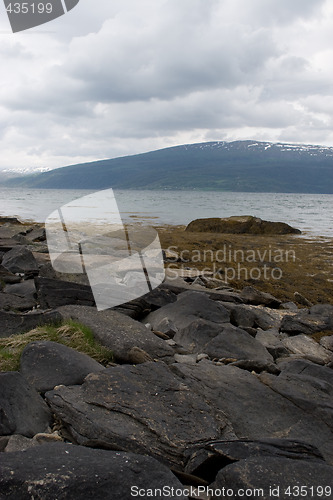 Image of Fjord with small mountain in background