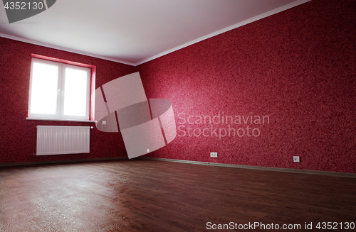 Image of corner of empty red room