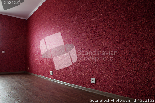 Image of part of empty red room