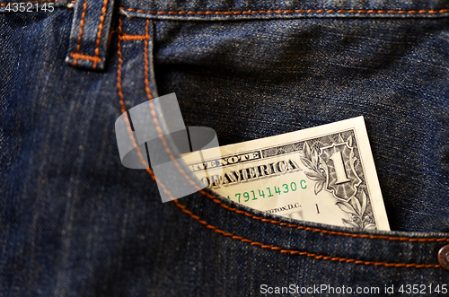Image of Jeans pocket with one dollar banknotes