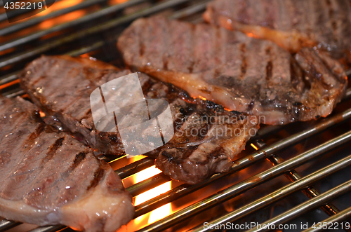 Image of Beef steaks on the grill