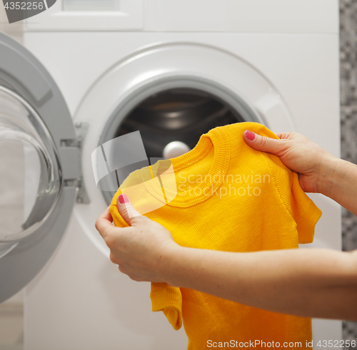 Image of T-shirt in the hands 