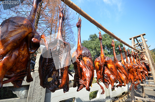 Image of Rows of cured meat hanging to dry