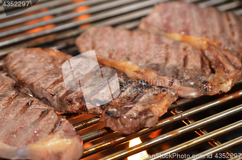 Image of Beef steaks on the grill