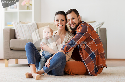 Image of happy family with baby having fun at home