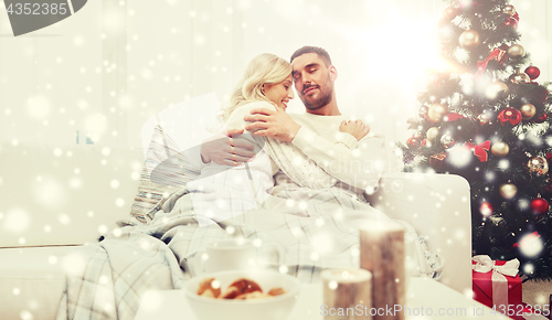 Image of happy couple at home with christmas tree