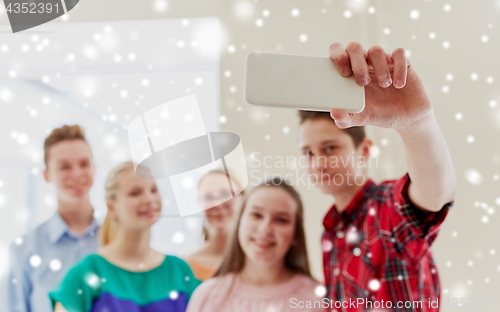 Image of group of students taking selfie with smartphone