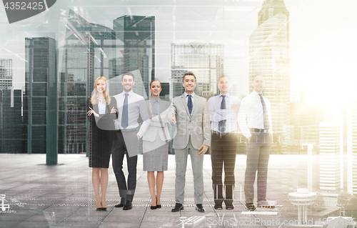 Image of group of smiling businessmen making handshake