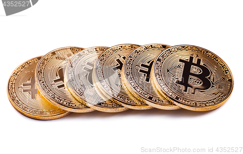 Image of Shiny Bitcoin souvenire coins row isolated