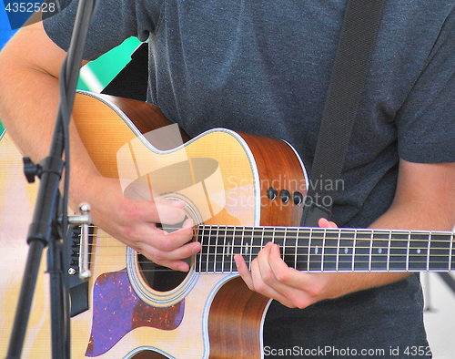 Image of Male guitarist.