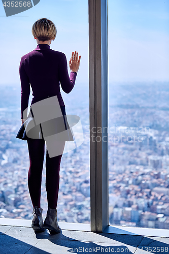 Image of Young woman in the window