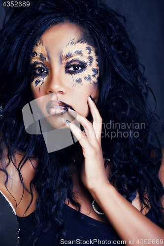Image of beauty afro girl with cat make up, creative leopard print closeu