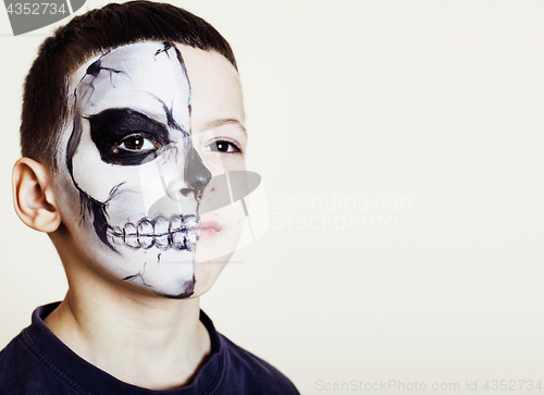 Image of little cute boy with facepaint like skeleton to celebrate hallow