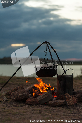 Image of Preparing food on campfire