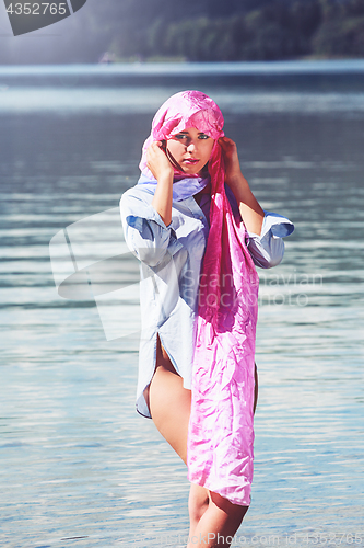 Image of Beauty with headscarf in the water