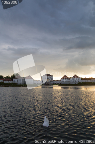 Image of Dramatic scenery of post storm sunset of Nymphenburg palace in Munich Germany.