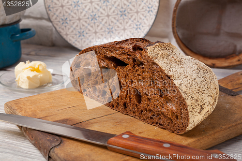 Image of Homemade rye bread on old cutting board