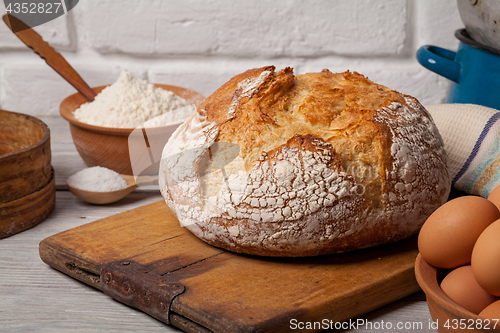 Image of Homemade bread on old cutting board