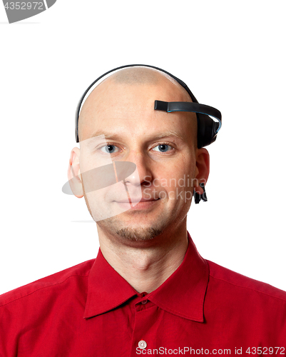 Image of Portrait of young man with electroencephalography (EEG) headset 