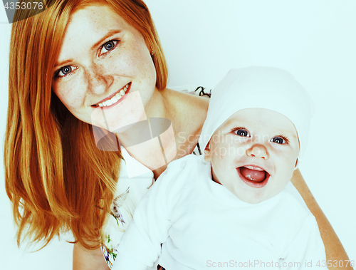 Image of young beauty mother with cute baby, red head happy modern family