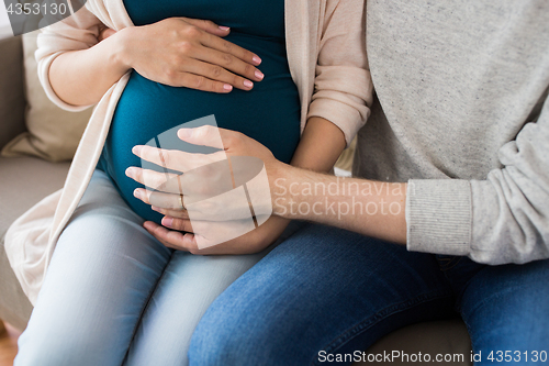 Image of close up of man and pregnant woman