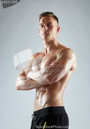 Image of young man or bodybuilder with bare torso