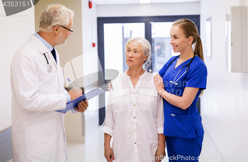 Image of doctor, nurse and senior woman patient at hospital