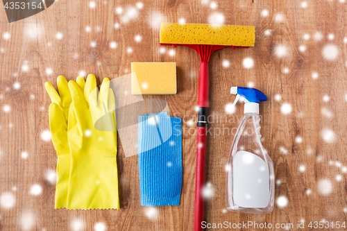 Image of squeegee with window cleaning stuff on wood